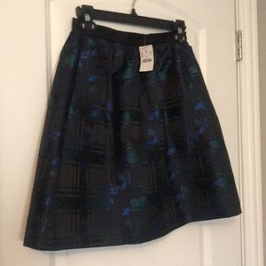 It has pockets! NWT J. Crew skirt, Size 0. Black with royal blue and emerald.